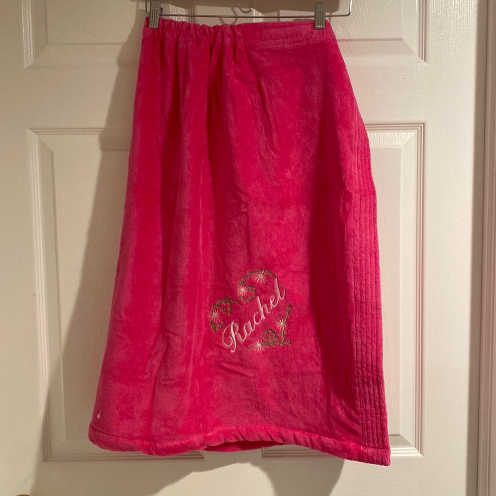 towel full sized in pink brand new with embroidered flowers and name Rachel